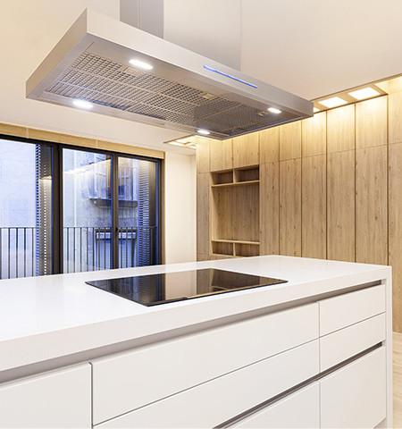American kitchen with laminated parquet floor and white lacquered furniture