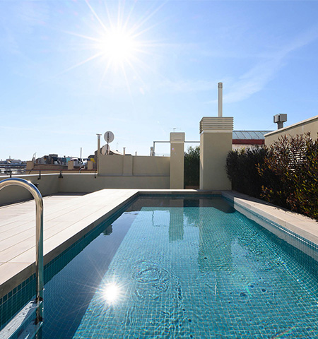 Communal swimming pool with solarium located on the roof